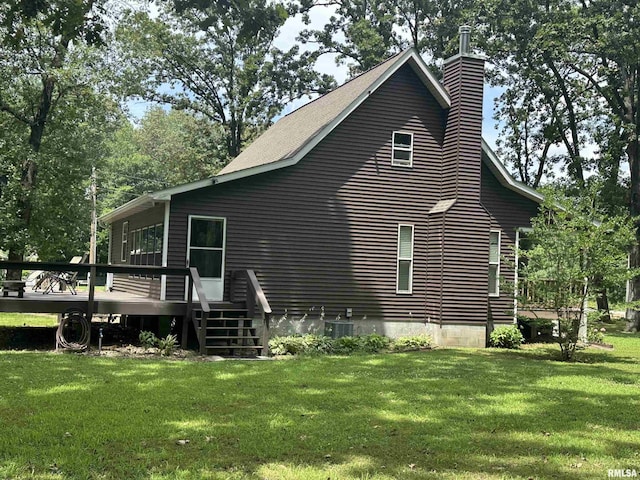 11382 Petroff Rd, Benton, IL 62812 - view of side of home with a deck, a chimney, and a lawn