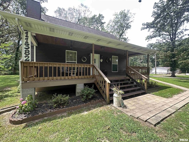 11382 Petroff Rd, Benton, IL 62812 - view of front of home featuring a front yard, a porch, a chimney, and stairs