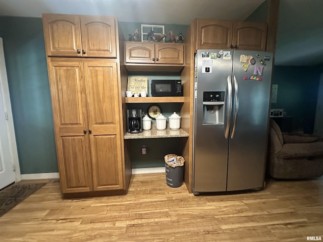 11382 Petroff Rd, Benton, IL 62812 - kitchen featuring stainless steel refrigerator with ice dispenser, light wood-type flooring, and black microwave