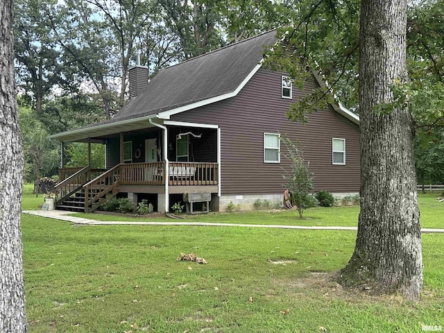 11382 Petroff Rd, Benton, IL 62812 - view of front of house with covered porch, a chimney, a front lawn, and roof with shingles
