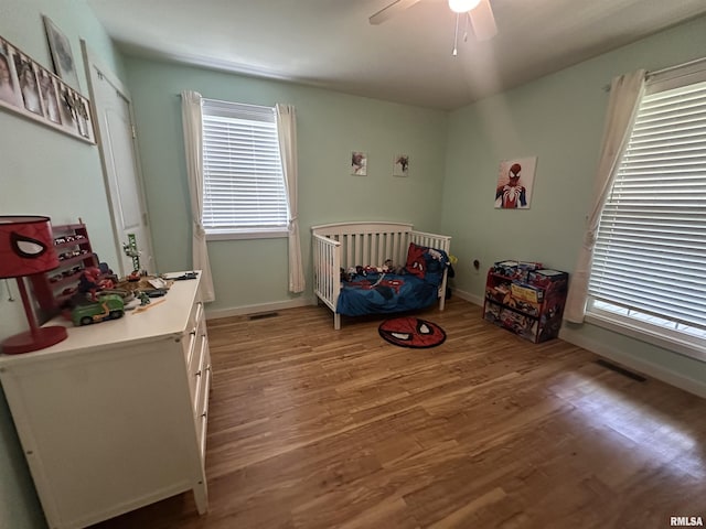 11382 Petroff Rd, Benton, IL 62812 - bedroom featuring light wood finished floors and ceiling fan