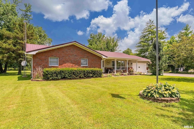 13399 S County Line Rd, West Frankfort, IL 62896 - ranch-style house featuring a garage, a front lawn, a metal roof, brick siding, and driveway