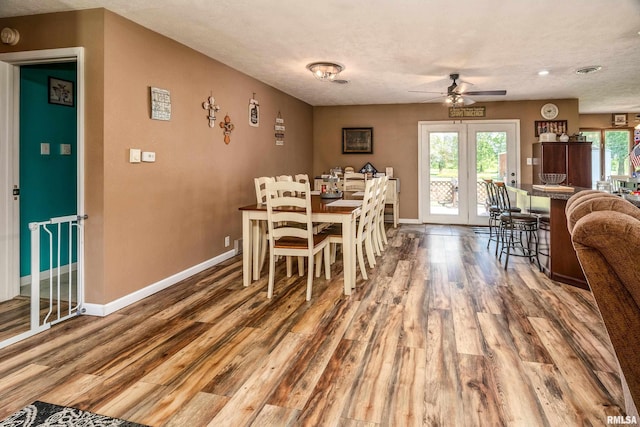 13399 S County Line Rd, West Frankfort, IL 62896 - dining space with a ceiling fan, wood finished floors, and plenty of natural light