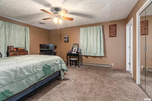 13399 S County Line Rd, West Frankfort, IL 62896 - carpeted bedroom featuring a textured ceiling, baseboard heating, and ceiling fan