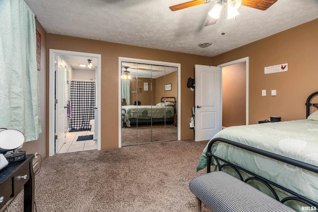 13399 S County Line Rd, West Frankfort, IL 62896 - carpeted bedroom with a closet, a textured ceiling, ceiling fan, and connected bathroom