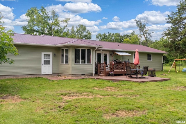 13399 S County Line Rd, West Frankfort, IL 62896 - back of house featuring a playground, a metal roof, a wooden deck, and a lawn