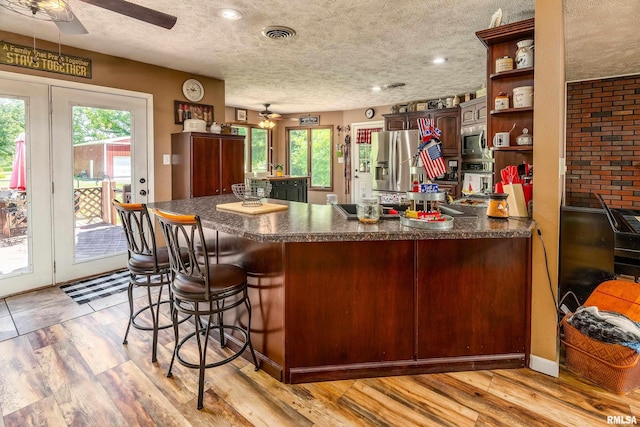 13399 S County Line Rd, West Frankfort, IL 62896 - kitchen with a ceiling fan, appliances with stainless steel finishes, plenty of natural light, and a textured ceiling