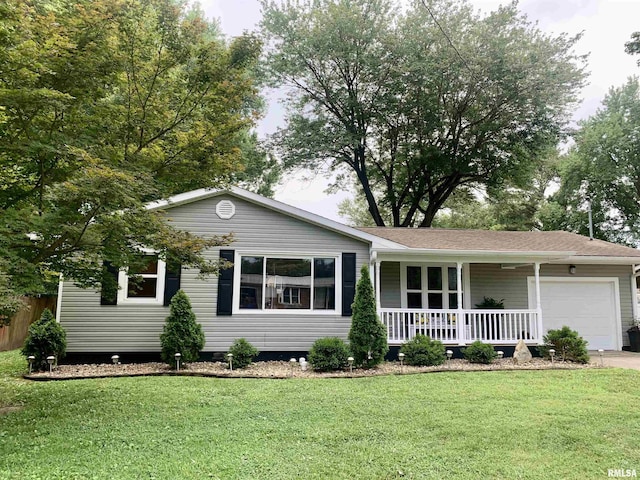 1203 W Goodall St, Marion, IL 62959 - ranch-style home with a porch, a garage, a front lawn, and driveway