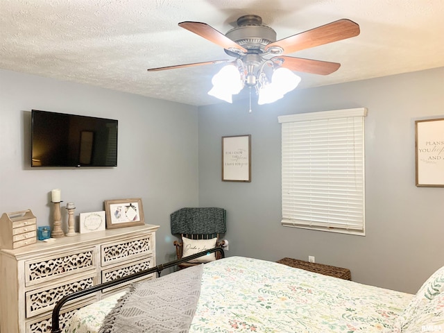 1203 W Goodall St, Marion, IL 62959 - bedroom with a ceiling fan and a textured ceiling