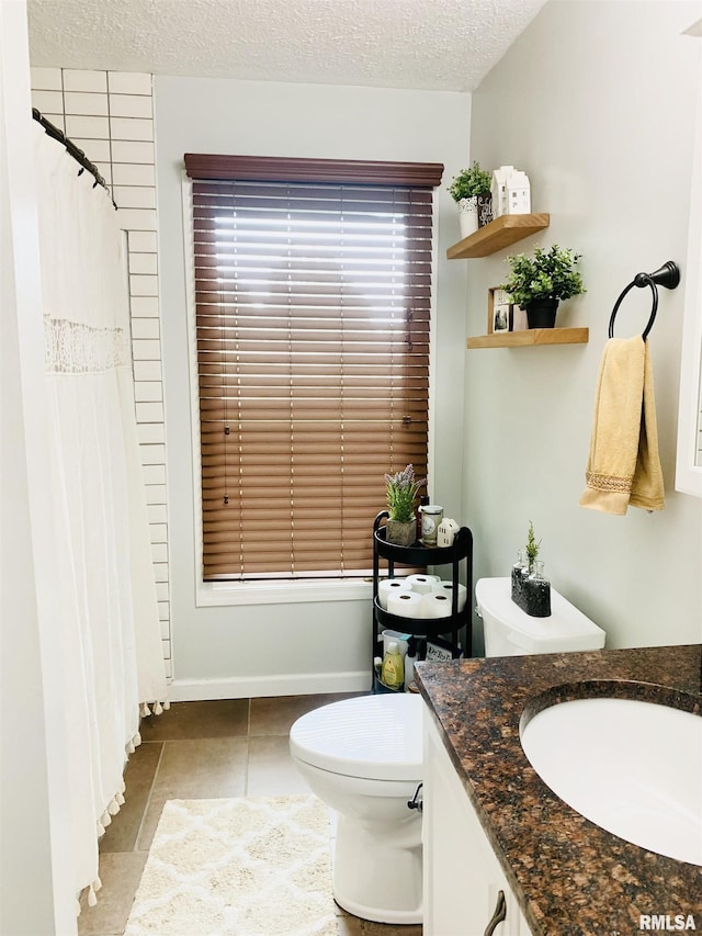 1203 W Goodall St, Marion, IL 62959 - full bathroom featuring vanity, tile patterned flooring, a textured ceiling, and a shower with curtain