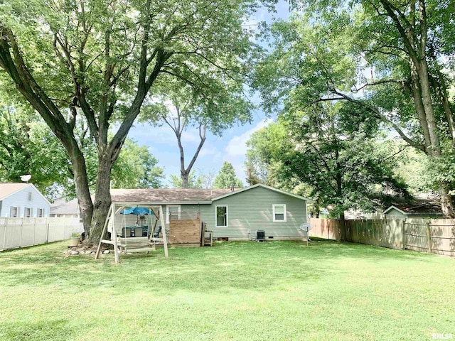1203 W Goodall St, Marion, IL 62959 - rear view of house with a fenced backyard