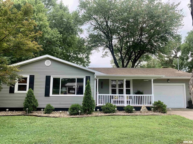 1203 W Goodall St, Marion, IL 62959 - ranch-style house with a porch, an attached garage, a front yard, and driveway