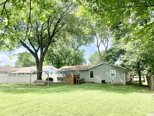 1203 W Goodall St, Marion, IL 62959 - rear view of house featuring a fenced backyard and crawl space