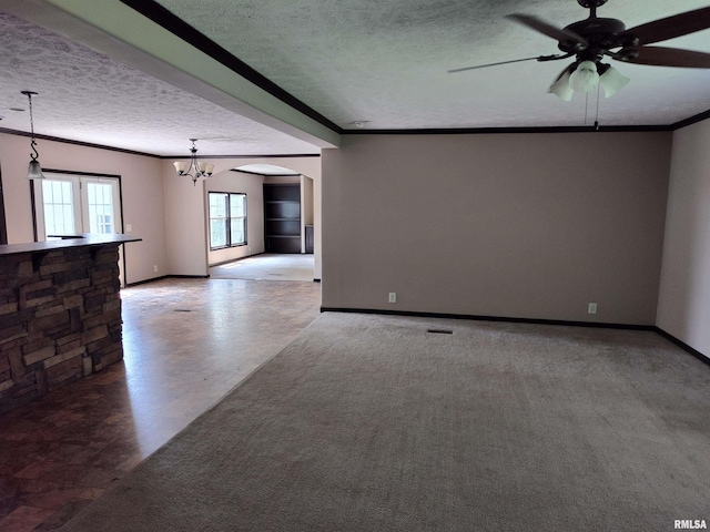 45 Davis Ridge Rd, Eldorado, IL 62930 - spare room with a textured ceiling, ornamental molding, a ceiling fan, a chandelier, and arched walkways