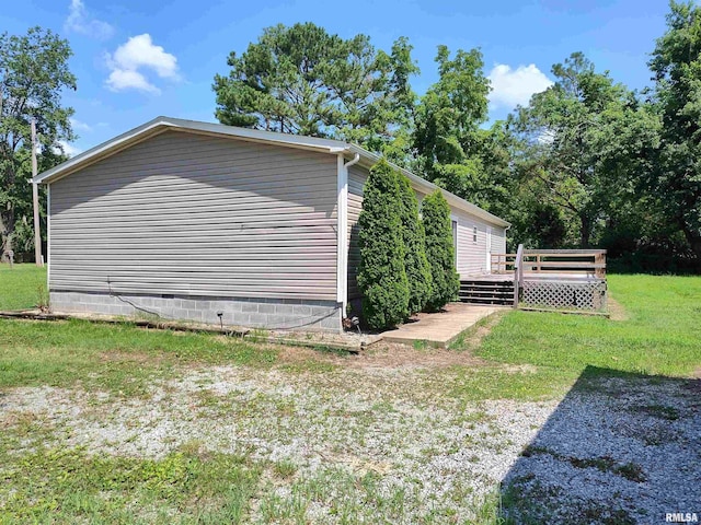 45 Davis Ridge Rd, Eldorado, IL 62930 - view of property exterior featuring a wooden deck and a lawn
