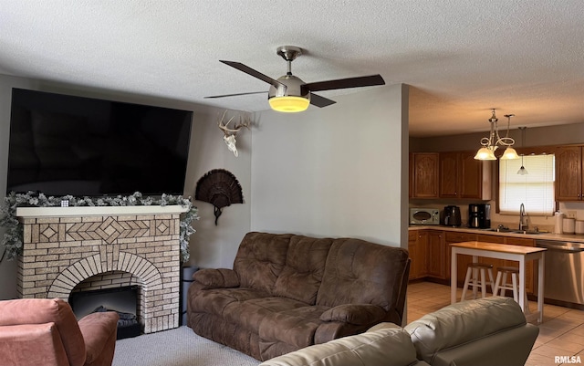 1409 Rig, Salem, IL 62881 - living room featuring a ceiling fan, a textured ceiling, a fireplace, and light tile patterned floors