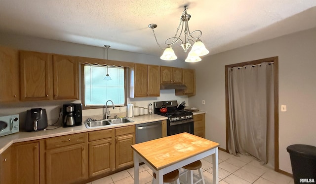 1409 Rig, Salem, IL 62881 - kitchen with appliances with stainless steel finishes, under cabinet range hood, light countertops, light tile patterned floors, and a chandelier