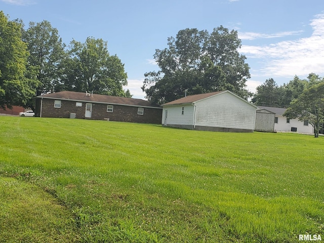 600 W Collins St, Goreville, IL 62939 - view of grassy yard featuring a storage shed