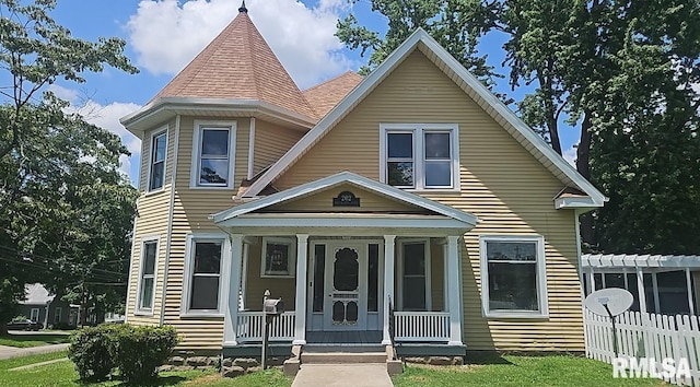 202 E 8th St, Mount Carmel, IL 62863 - victorian-style house featuring a porch and a pergola
