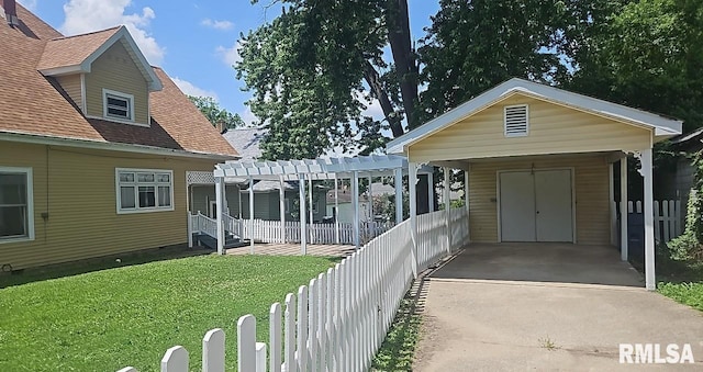 202 E 8th St, Mount Carmel, IL 62863 - view of front of home featuring a pergola, concrete driveway, and roof with shingles