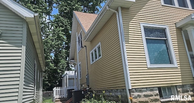 202 E 8th St, Mount Carmel, IL 62863 - view of home's exterior with a central AC unit
