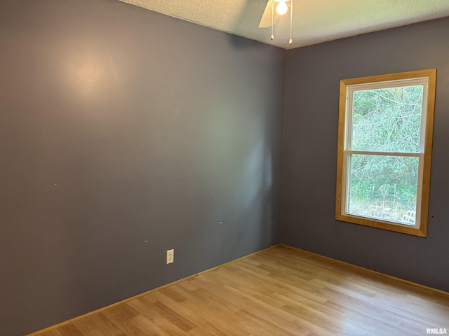 2780 Campground Rd, Anna, IL 62906 - unfurnished room featuring light wood-style floors, a textured ceiling, and a ceiling fan
