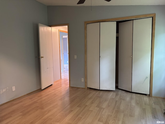 2780 Campground Rd, Anna, IL 62906 - unfurnished bedroom featuring light wood-style flooring, a closet, and a ceiling fan