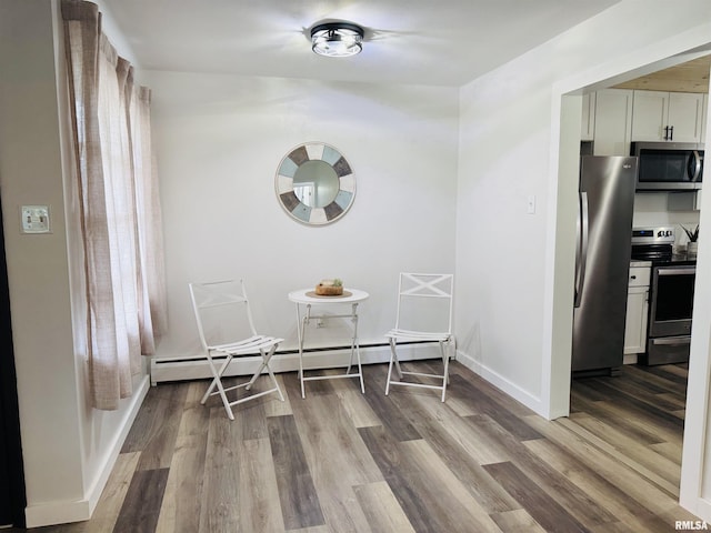 510 Morgan St, Anna, IL 62906 - dining space featuring wood finished floors and a baseboard radiator