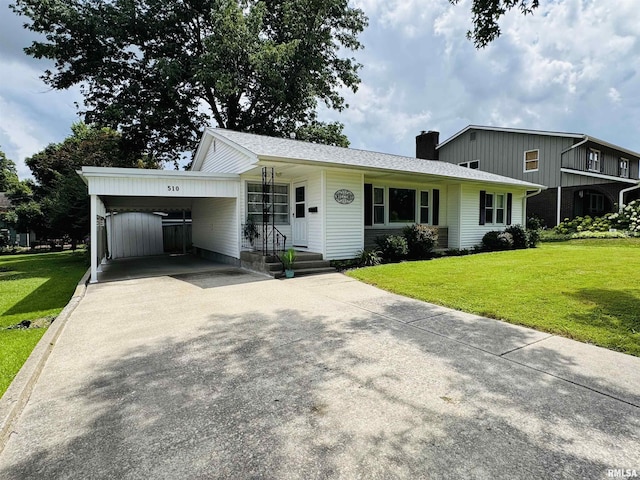 510 Morgan St, Anna, IL 62906 - view of front of house featuring concrete driveway, a chimney, a front yard, and a carport