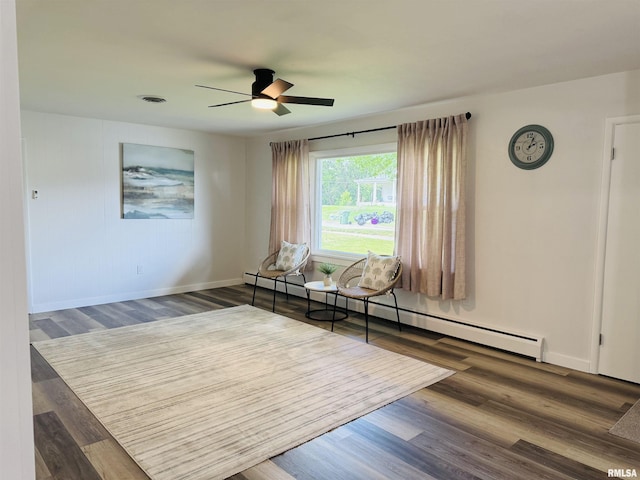510 Morgan St, Anna, IL 62906 - living area with a baseboard heating unit, ceiling fan, and wood finished floors