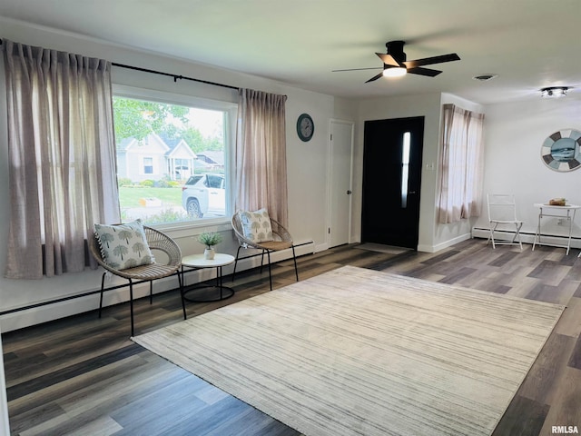 510 Morgan St, Anna, IL 62906 - foyer entrance featuring a baseboard heating unit, a baseboard radiator, ceiling fan, and wood finished floors