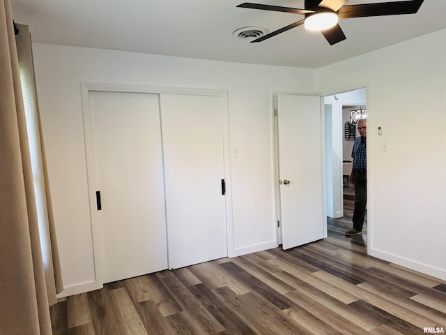 510 Morgan St, Anna, IL 62906 - unfurnished bedroom with wood finished floors, a closet, and ceiling fan