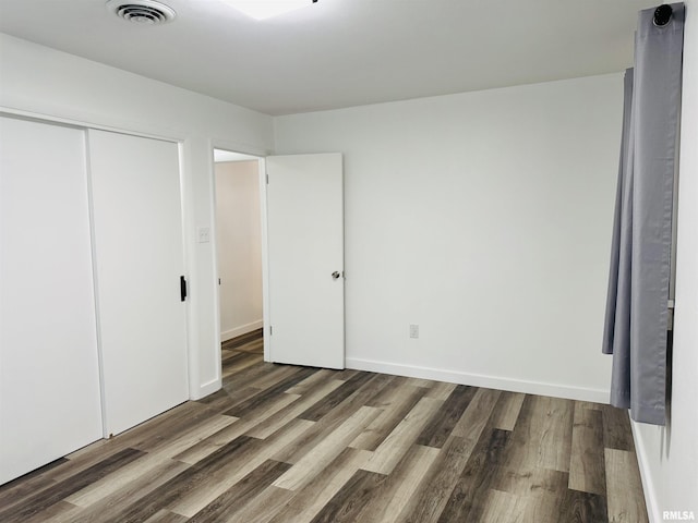 510 Morgan St, Anna, IL 62906 - unfurnished bedroom featuring wood finished floors and a closet