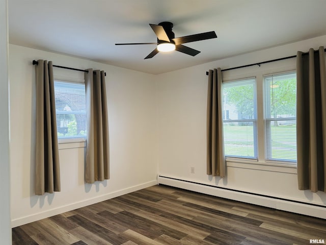 510 Morgan St, Anna, IL 62906 - spare room with baseboard heating, ceiling fan, and dark wood-style flooring