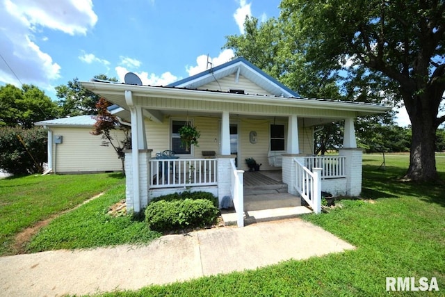 793 County Road 635 E, Wayne City, IL 62895 - bungalow featuring a porch and a front lawn