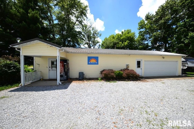 793 County Road 635 E, Wayne City, IL 62895 - ranch-style house featuring driveway, an attached garage, and a metal roof