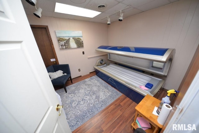 793 County Road 635 E, Wayne City, IL 62895 - misc room featuring a tanning bed, track lighting, and wood finished floors