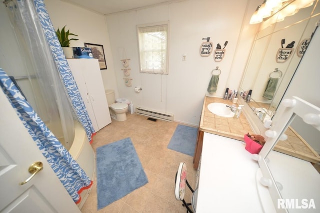 793 County Road 635 E, Wayne City, IL 62895 - bathroom featuring baseboard heating and vanity