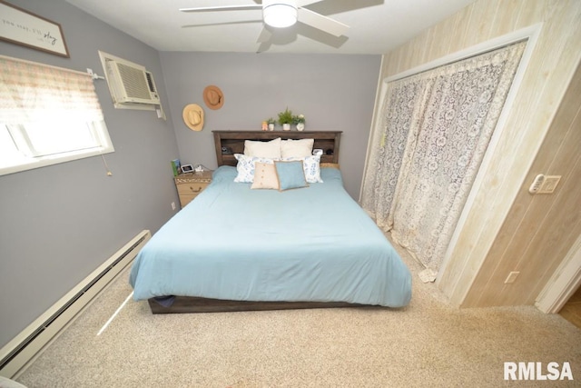 793 County Road 635 E, Wayne City, IL 62895 - bedroom with a baseboard radiator, carpet flooring, a wall mounted air conditioner, and ceiling fan