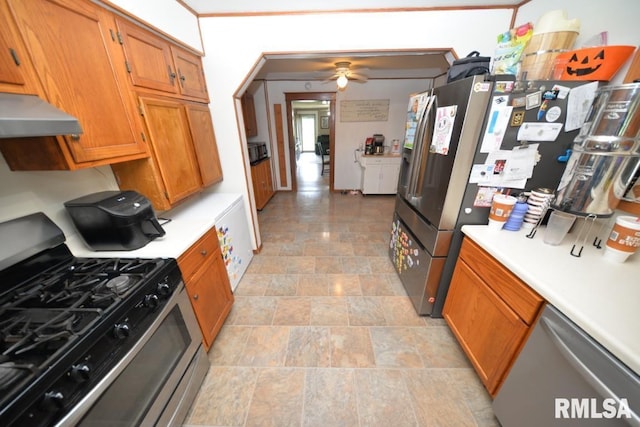 793 County Road 635 E, Wayne City, IL 62895 - kitchen featuring stainless steel appliances, under cabinet range hood, light countertops, brown cabinets, and a ceiling fan