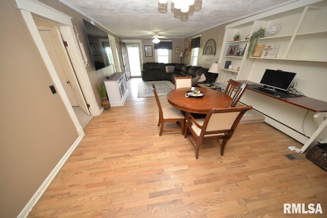 793 County Road 635 E, Wayne City, IL 62895 - dining room featuring crown molding, light wood-style flooring, and ceiling fan