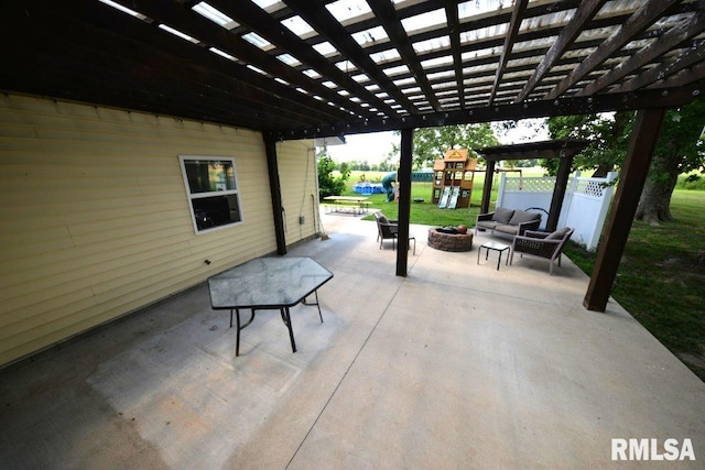 793 County Road 635 E, Wayne City, IL 62895 - view of patio / terrace with a pergola, a playground, and an outdoor living space with a fire pit