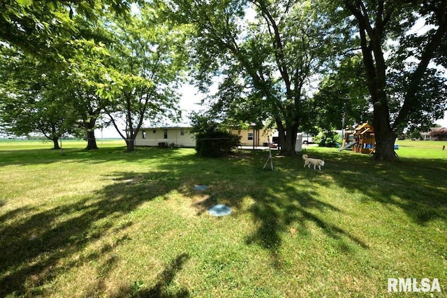 793 County Road 635 E, Wayne City, IL 62895 - view of grassy yard featuring a playground