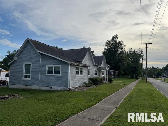 303 Elles Ave, Carterville, IL 62918 - view of property exterior featuring crawl space and a yard