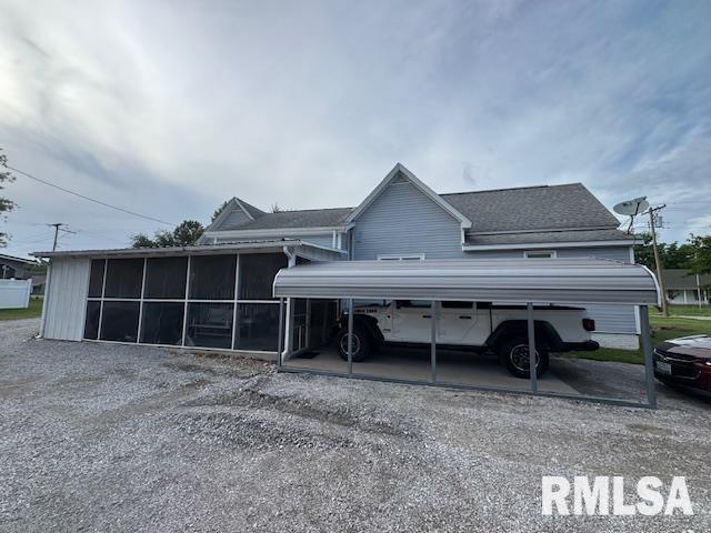 303 Elles Ave, Carterville, IL 62918 - view of side of property with a sunroom