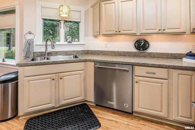 103 Woodland Trl, Anna, IL 62906 - kitchen featuring stainless steel dishwasher, dark countertops, decorative backsplash, and light wood-style flooring