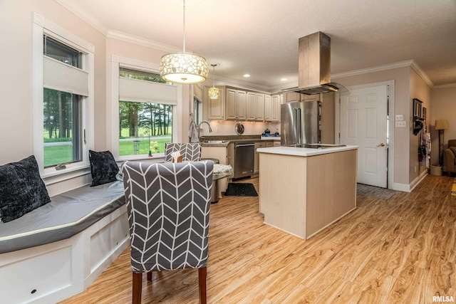 103 Woodland Trl, Anna, IL 62906 - kitchen with stainless steel appliances, a center island, light wood-style floors, crown molding, and hanging light fixtures