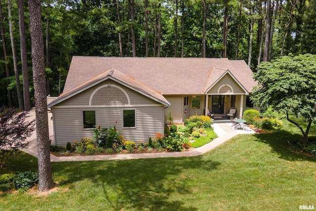 103 Woodland Trl, Anna, IL 62906 - view of front of house featuring a porch, a front lawn, and roof with shingles