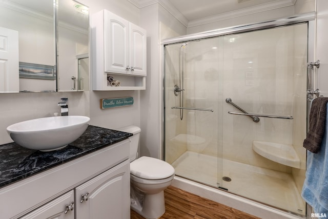 103 Woodland Trl, Anna, IL 62906 - bathroom featuring vanity, a stall shower, ornamental molding, and wood finished floors