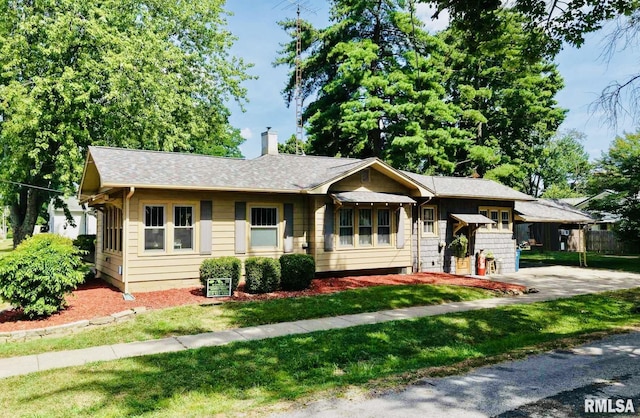 308 W Reed St, Benton, IL 62812 - view of front of property featuring a chimney, a front lawn, and a shingled roof